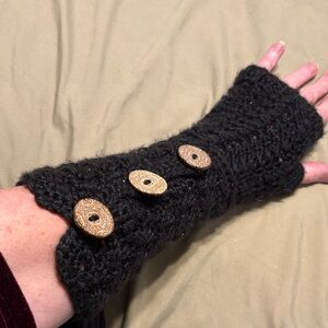 Nice heavy crocheted fingerless gloves with three buttons detailing